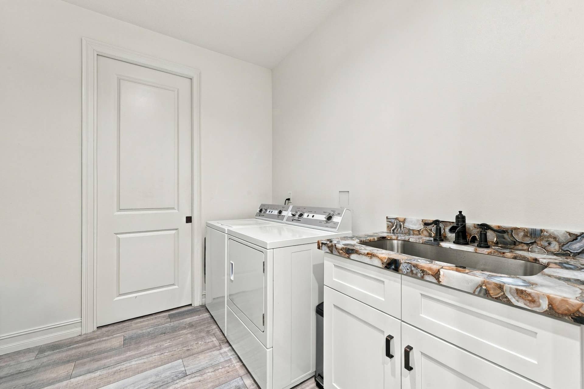 8700 SW 2nd Street, Okeechobee, FL 34974 Laundry Room with Storage Cabinets