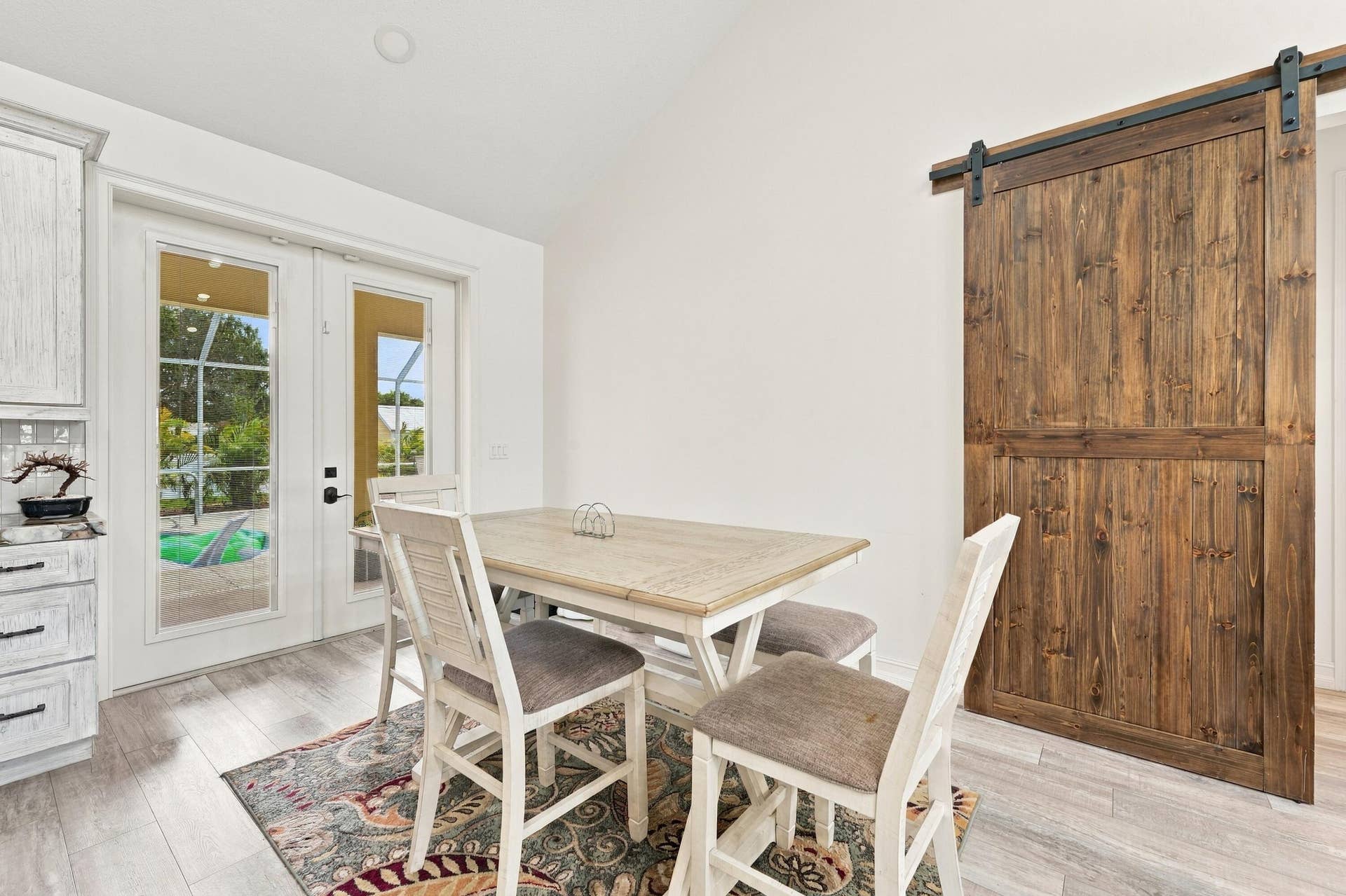 8700 SW 2nd Street, Okeechobee, FL 34974 Dining Area with Rustic Barn Door