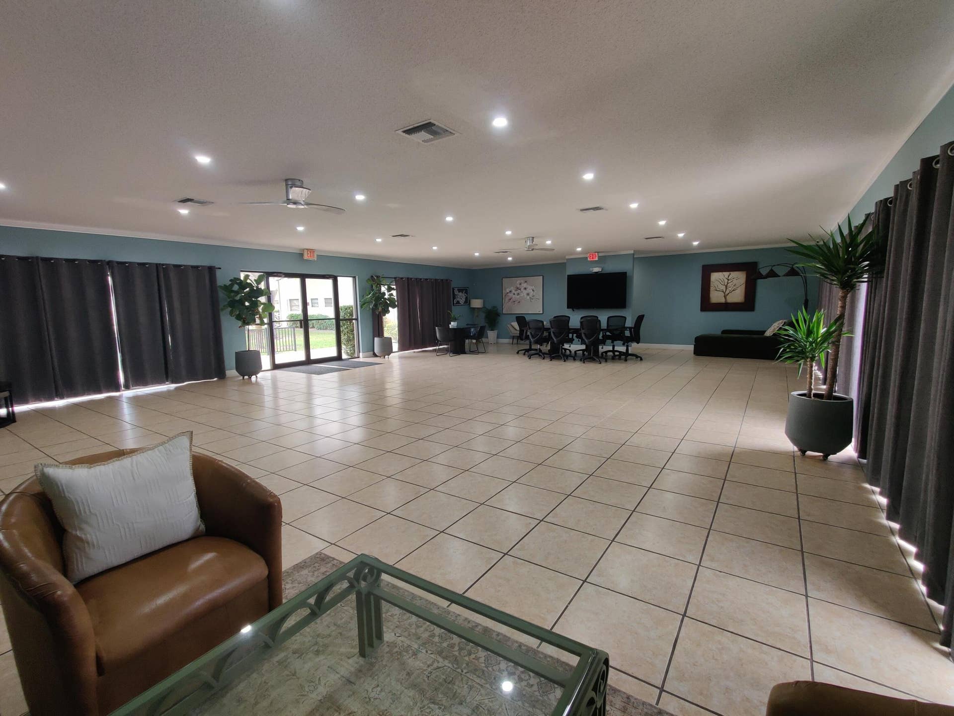 2700 S OAKLAND FOREST Drive, #603, Oakland Park, FL 33309 Expansive open floor plan featuring large-format ceramic tile flooring, recessed lighting, ceiling fans, and glass sliding doors