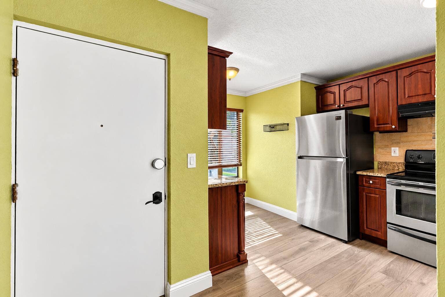 2572 RIVERSIDE Drive, #413, Coral Springs, FL 33065 Bright Kitchen Entryway with Warm Wood C
