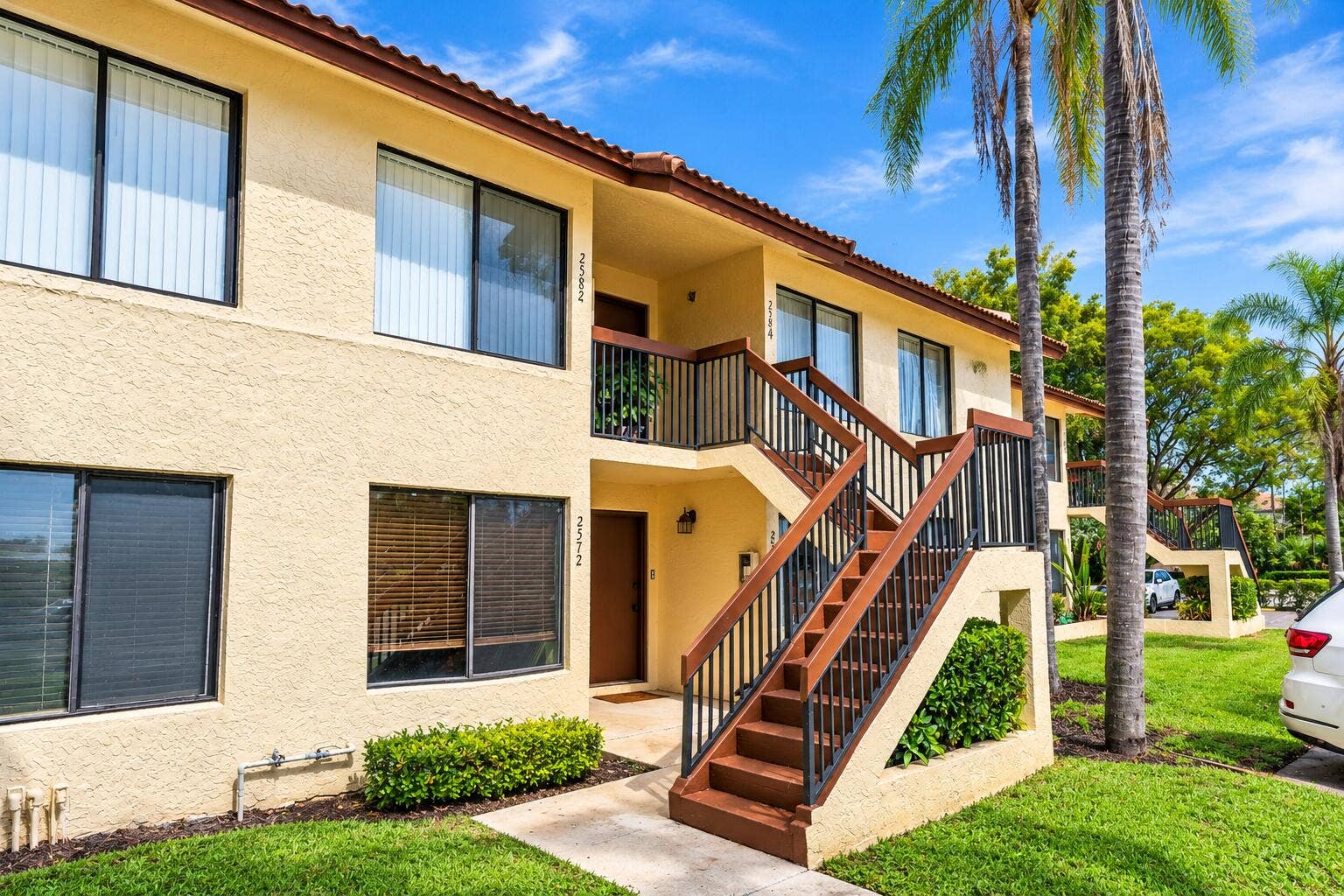 2572 RIVERSIDE Drive, #413, Coral Springs, FL 33065 Sunny Tropical Apartment Exterior (1)