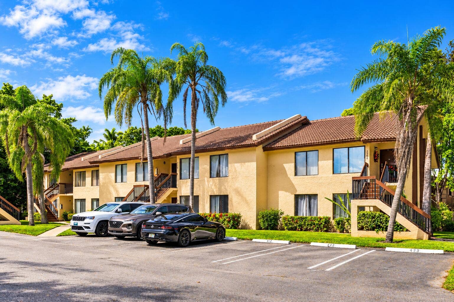 2572 RIVERSIDE Drive, #413, Coral Springs, FL 33065 Tropical Palm-Side Apartment Complex