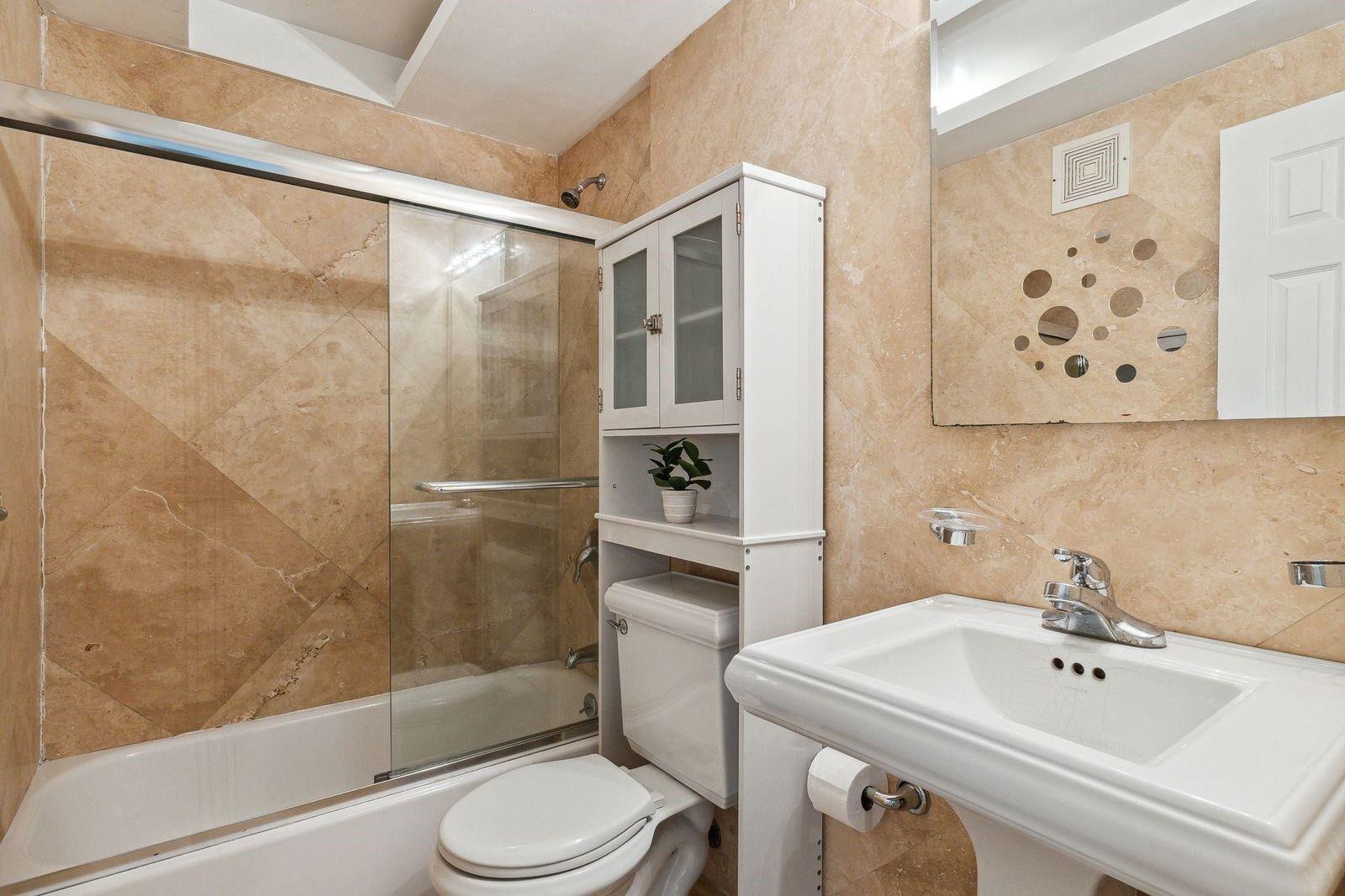 1878 NE 46TH Street, #C1, Fort Lauderdale, Fort Lauderdale, FL 33308 Marble bathroom tub-shower with glass door