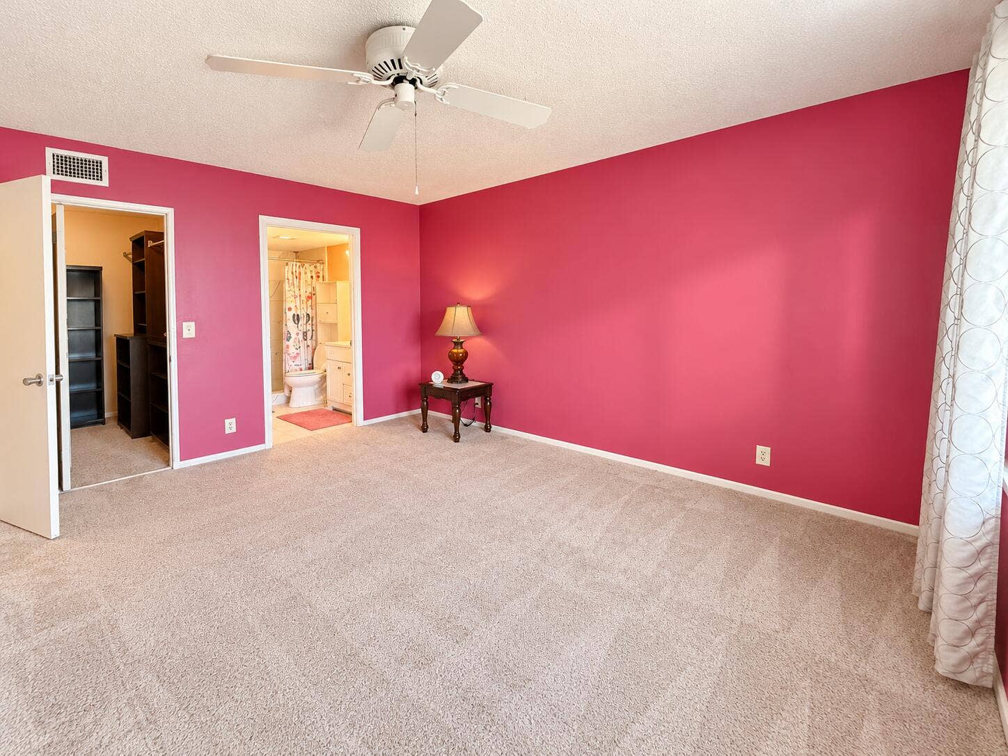 Bright Magenta Bedroom with Open Doorway