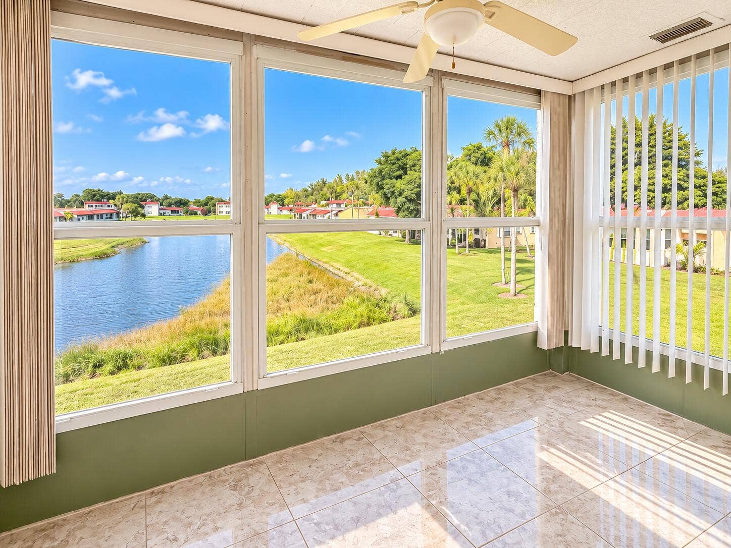 Bright Sunroom Overlooking the Pond