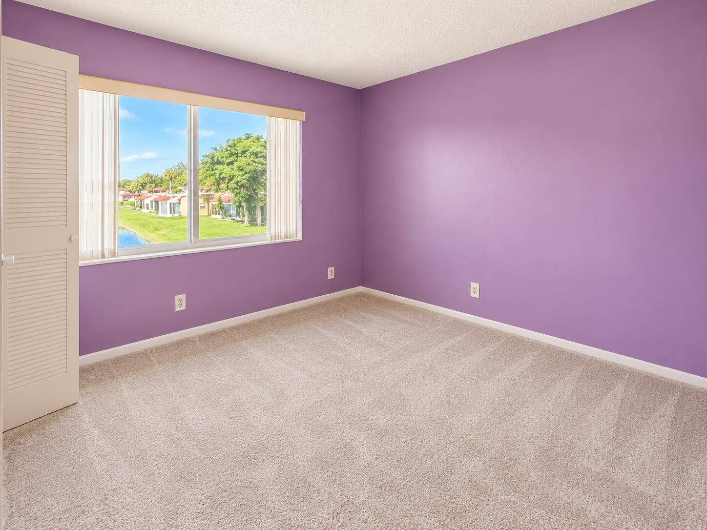 Bright Lavender Bedroom with Window View
