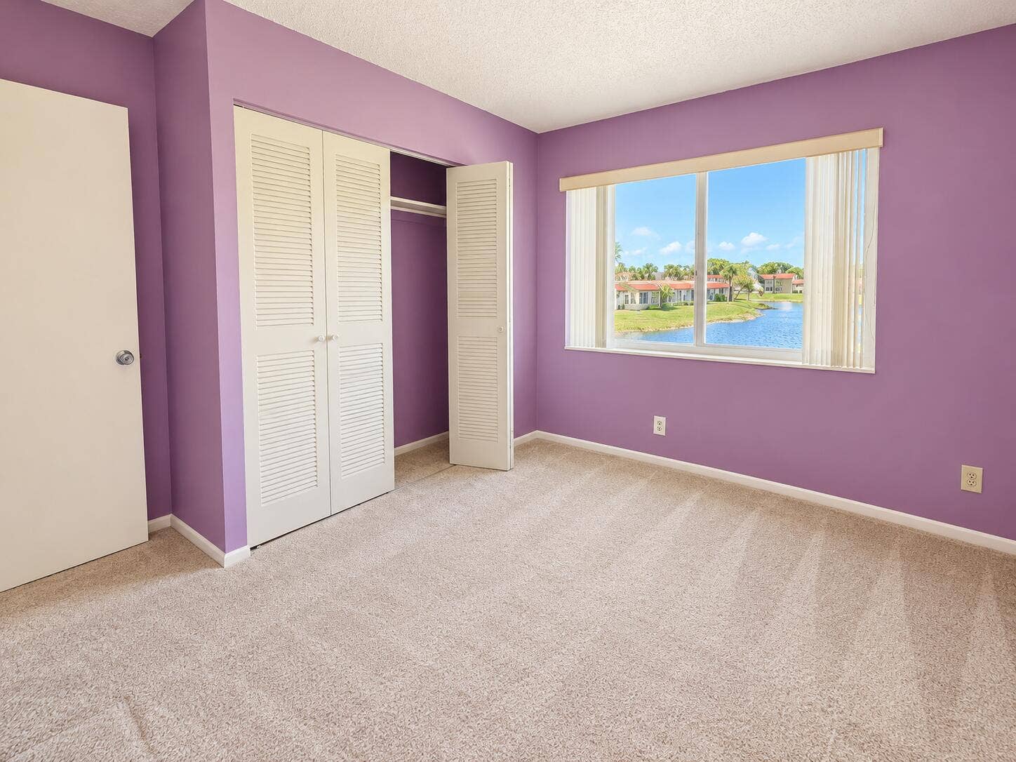 Bright Lavender Bedroom with Lake View