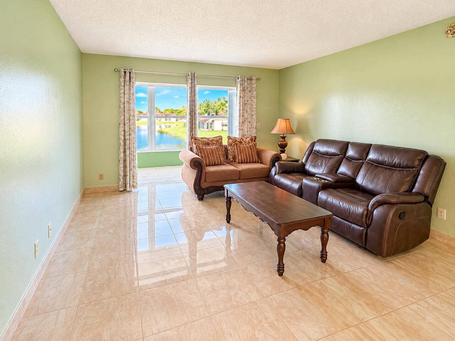 Bright Sage Living Room with Lake Views
