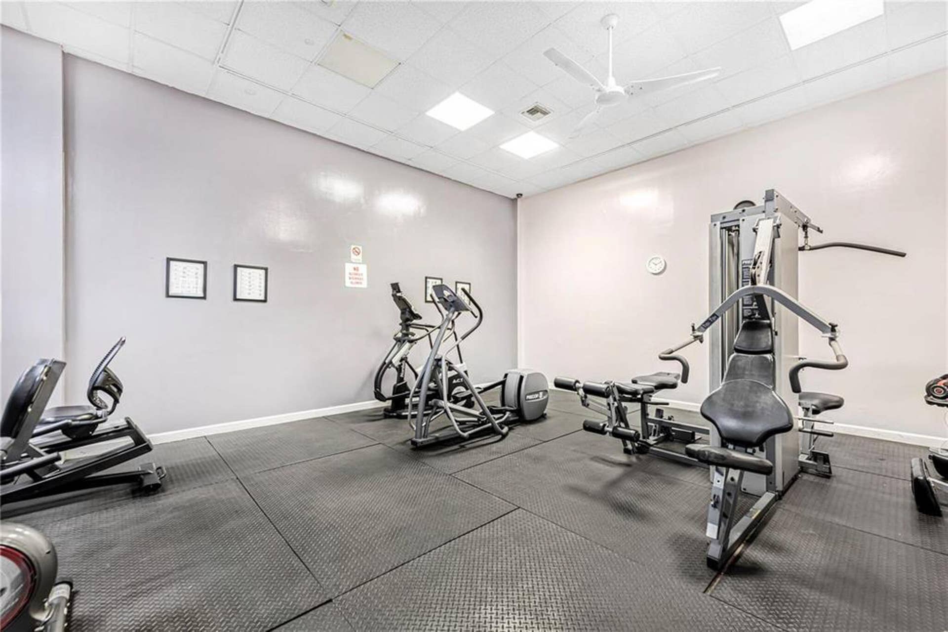 21109 NE 3RD Court, Miami, FL 33179 Fitness room featuring resilient rubber flooring, recessed overhead lighting, and a white ceiling fan