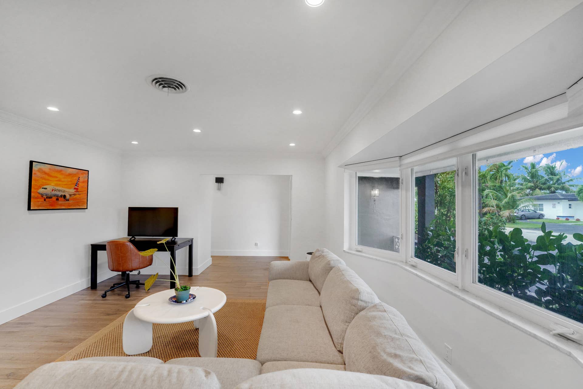 380 NW 35TH Court, Oakland Park, FL 33309 Living area featuring recessed lighting, and a multi-pane bay window