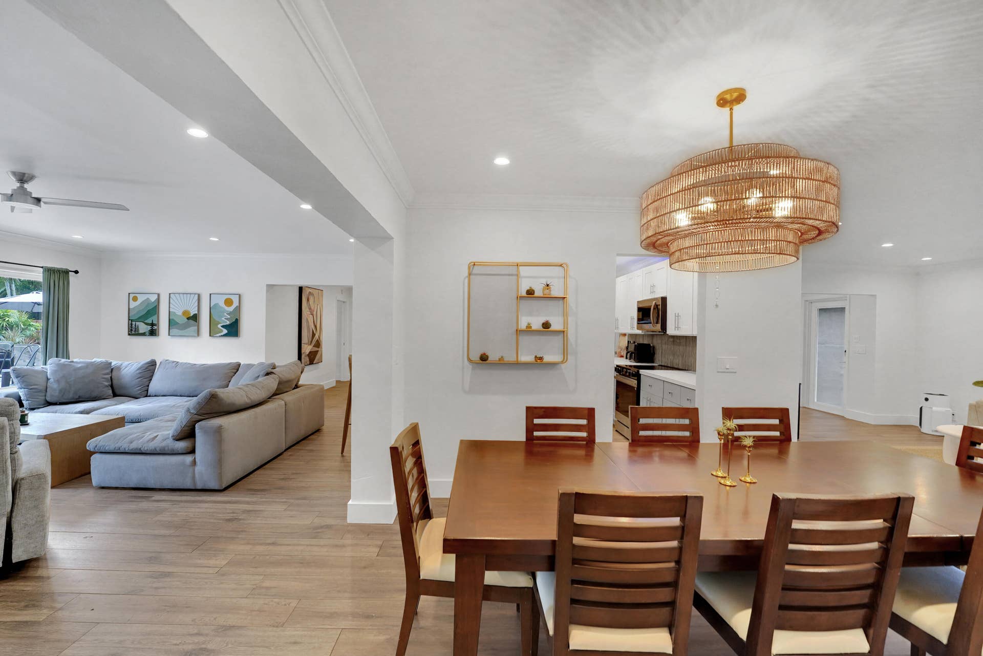 380 NW 35TH Court, Oakland Park, FL 33309 Open-concept interior featuring, recessed lighting, and a tiered woven-texture chandelier