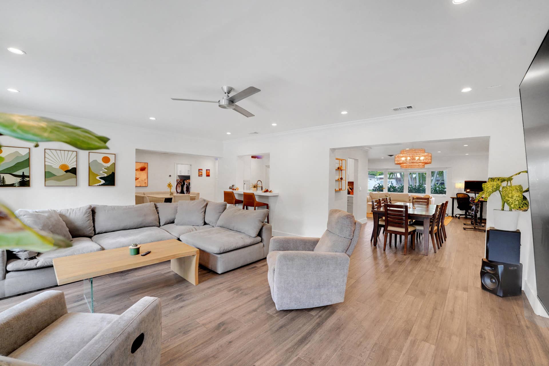 380 NW 35TH Court, Oakland Park, FL 33309 Open-concept living space featuring recessed lighting, a modern ceiling fan, and a breakfast bar