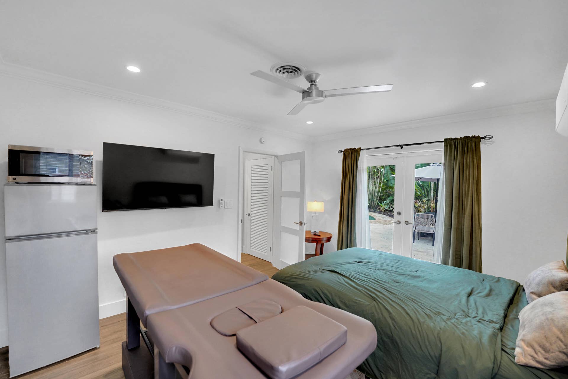 380 NW 35TH Court, Oakland Park, FL 33309 Interior space featuring wood-finish flooring, recessed lighting, a ceiling fan, and French doors