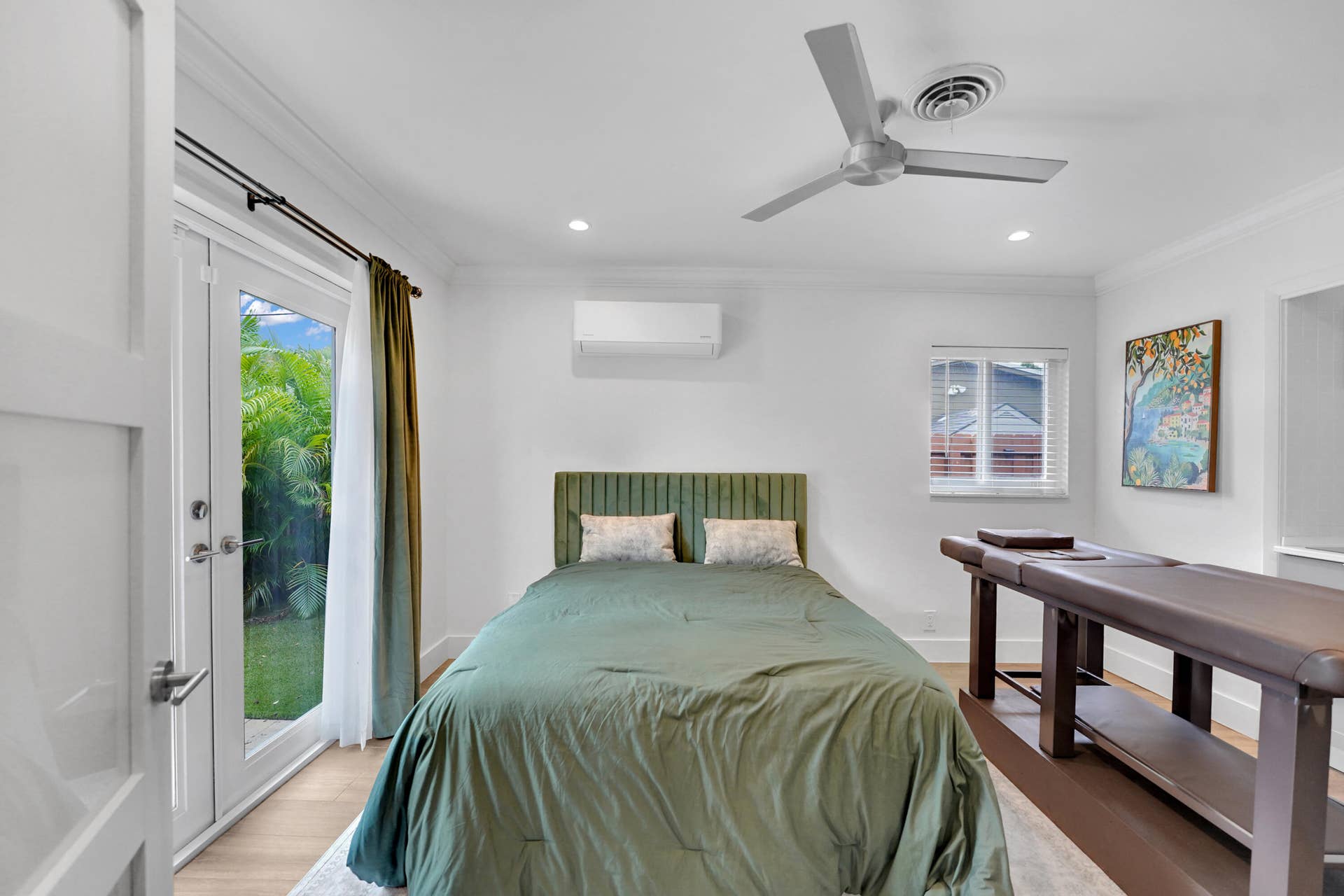 380 NW 35TH Court, Oakland Park, FL 33309 Room featuring wood-finish flooring, recessed lighting, a modern ceiling fan, wall-mounted climate control unit, and glass-paneled exterior doors