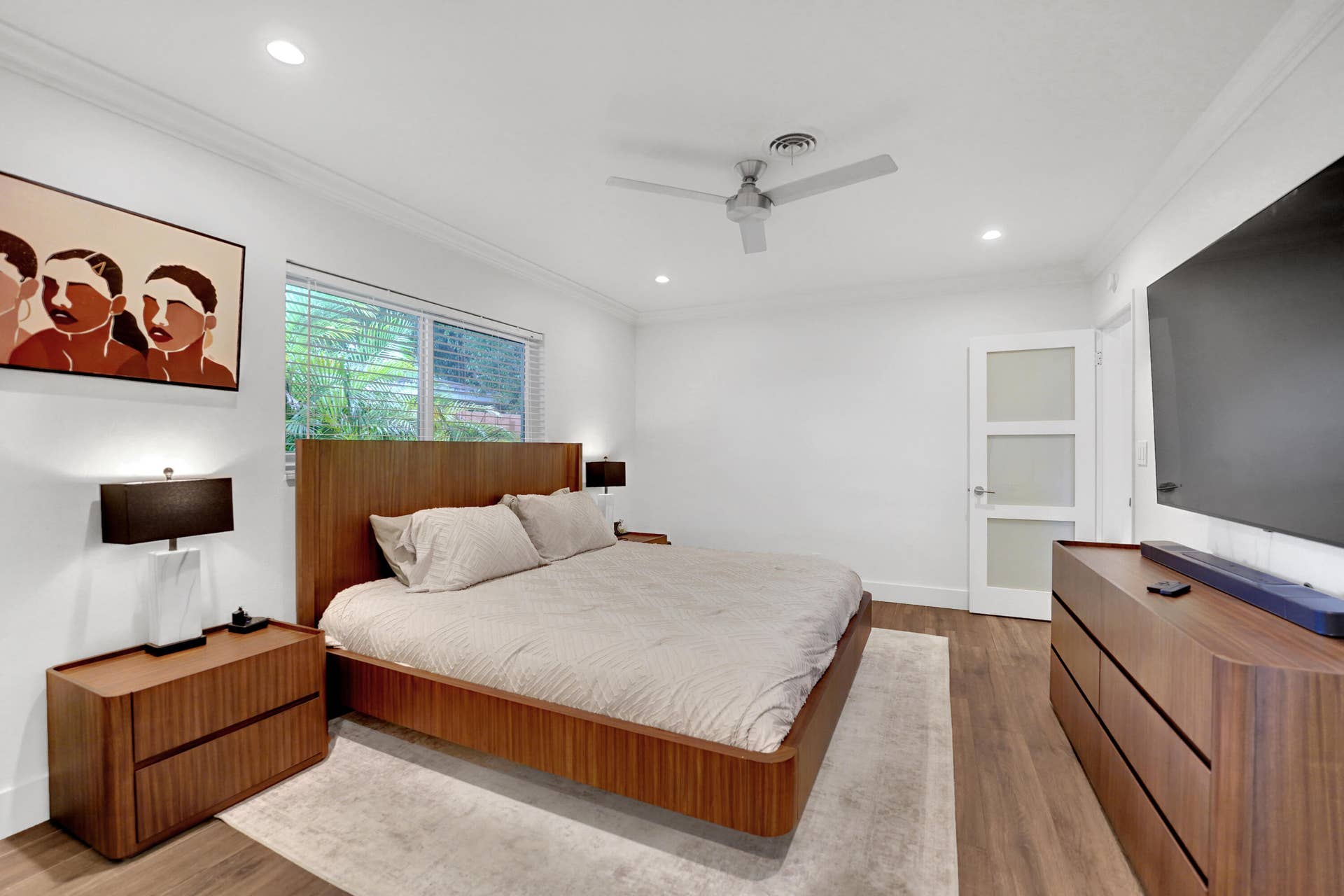 380 NW 35TH Court, Oakland Park, FL 33309 Room featuring wood-finish flooring, recessed lighting, a ceiling fan, and a three-panel door with frosted glass inserts