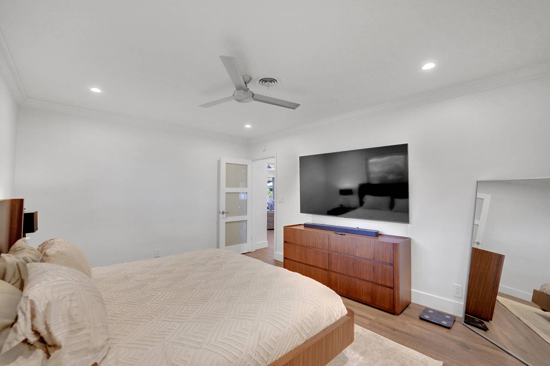 380 NW 35TH Court, Oakland Park, FL 33309 Interior space featuring recessed lighting, a modern ceiling fan, and a three-panel frosted glass door