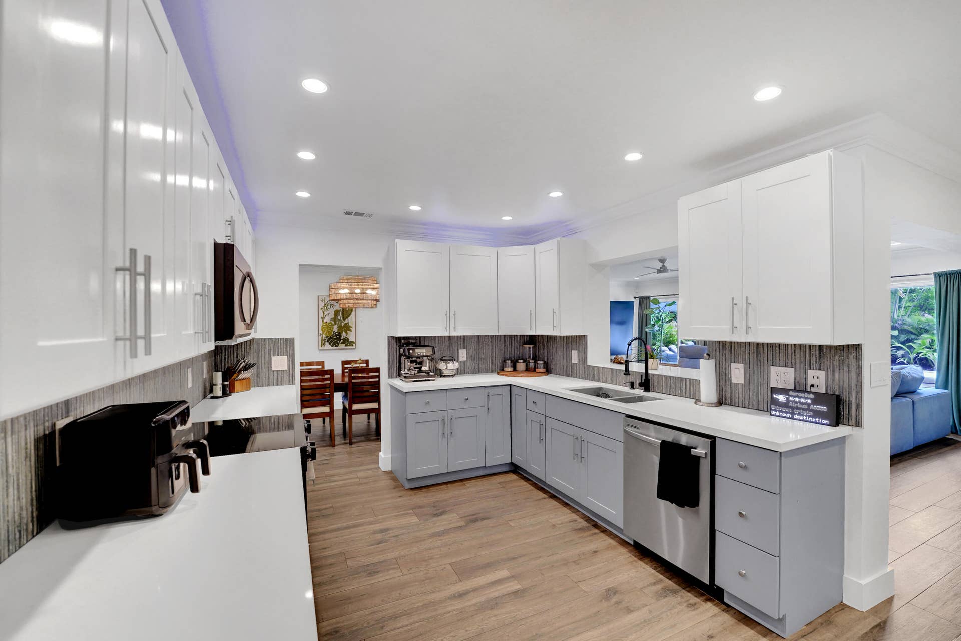 380 NW 35TH Court, Oakland Park, FL 33309 Kitchen featuring white upper cabinetry, grey base cabinetry, white solid-surface countertops, and recessed ceiling lighting