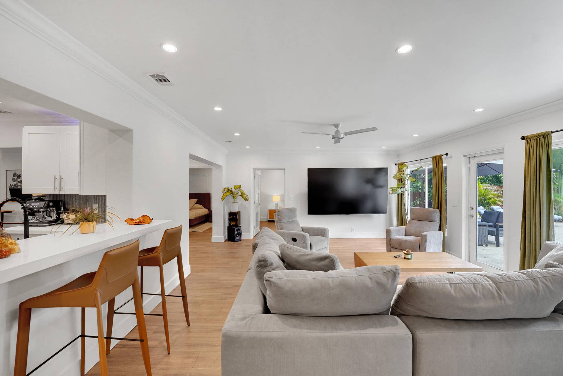 380 NW 35TH Court, Oakland Park, FL 33309 Open-concept living space featuring recessed lighting, a ceiling fan, and double-glass doors