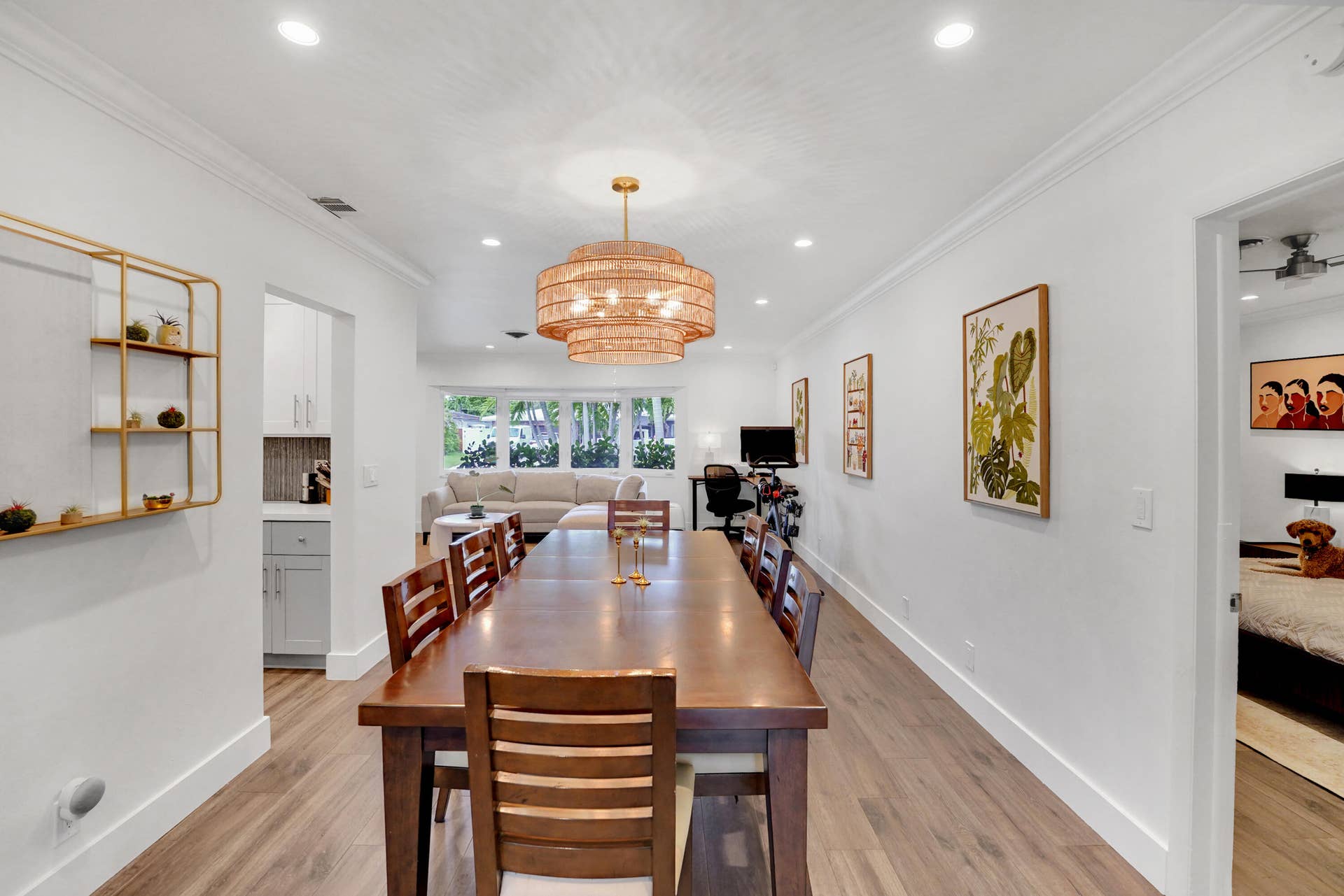 380 NW 35TH Court, Oakland Park, FL 33309 Multi-purpose room featuring wood-finish flooring, recessed lighting, crown molding, and a tiered drum chandelier