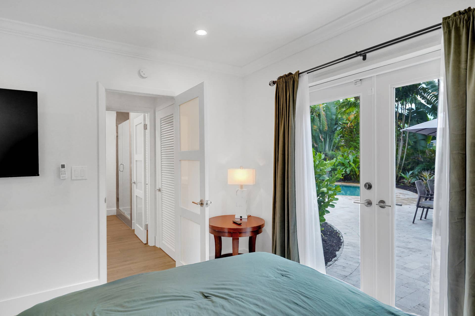 380 NW 35TH Court, Oakland Park, FL 33309 French doors with glass paneling, crown molding, louvered closet doors, and recessed lighting