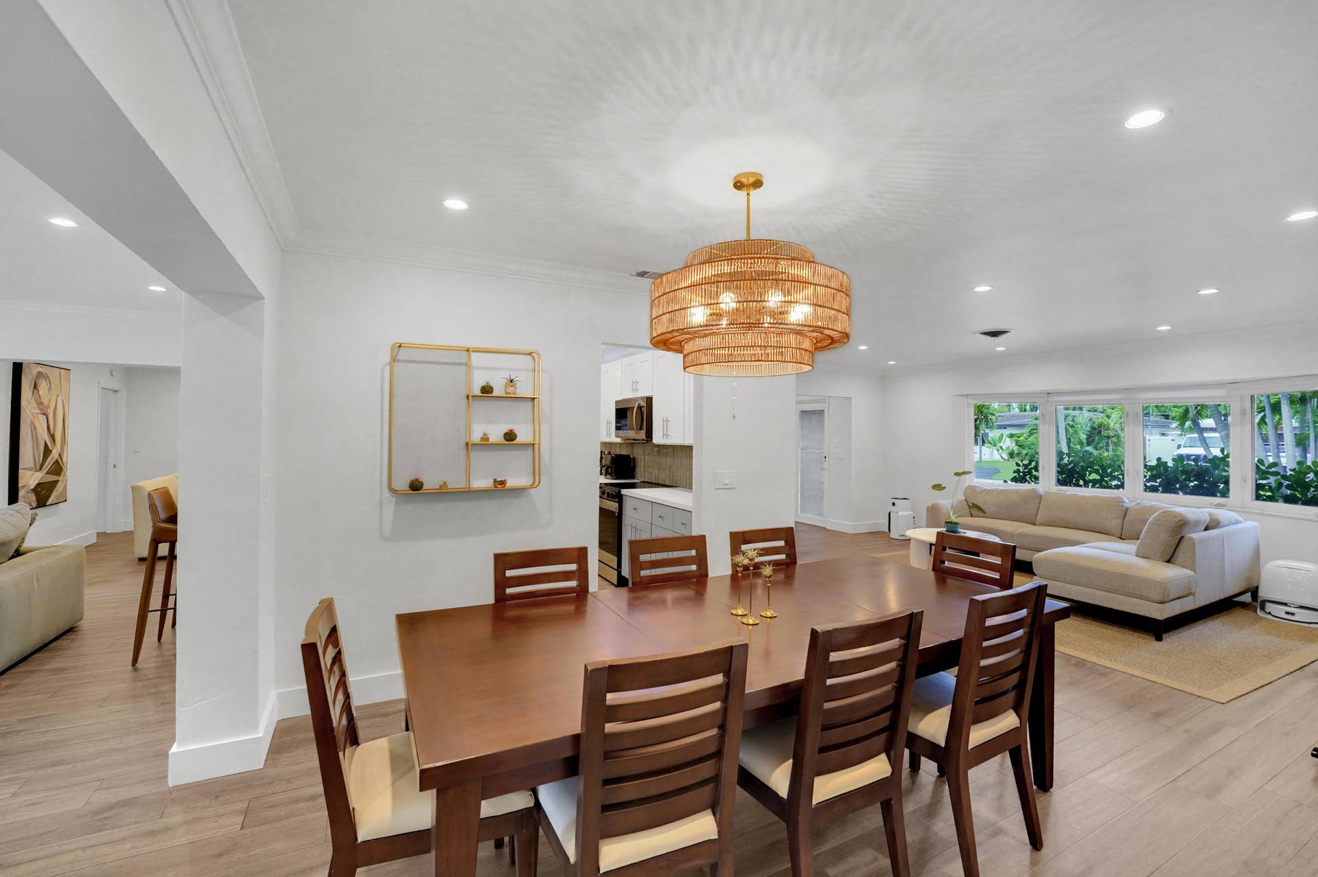 380 NW 35TH Court, Oakland Park, FL 33309 Open-concept area featuring recessed lighting, a tiered woven pendant light fixture, and large multi-pane windows
