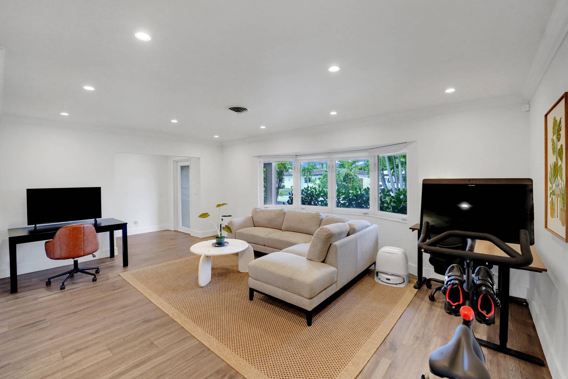 380 NW 35TH Court, Oakland Park, FL 33309 Open-concept interior featuring recessed lighting, and a multi-pane bay window