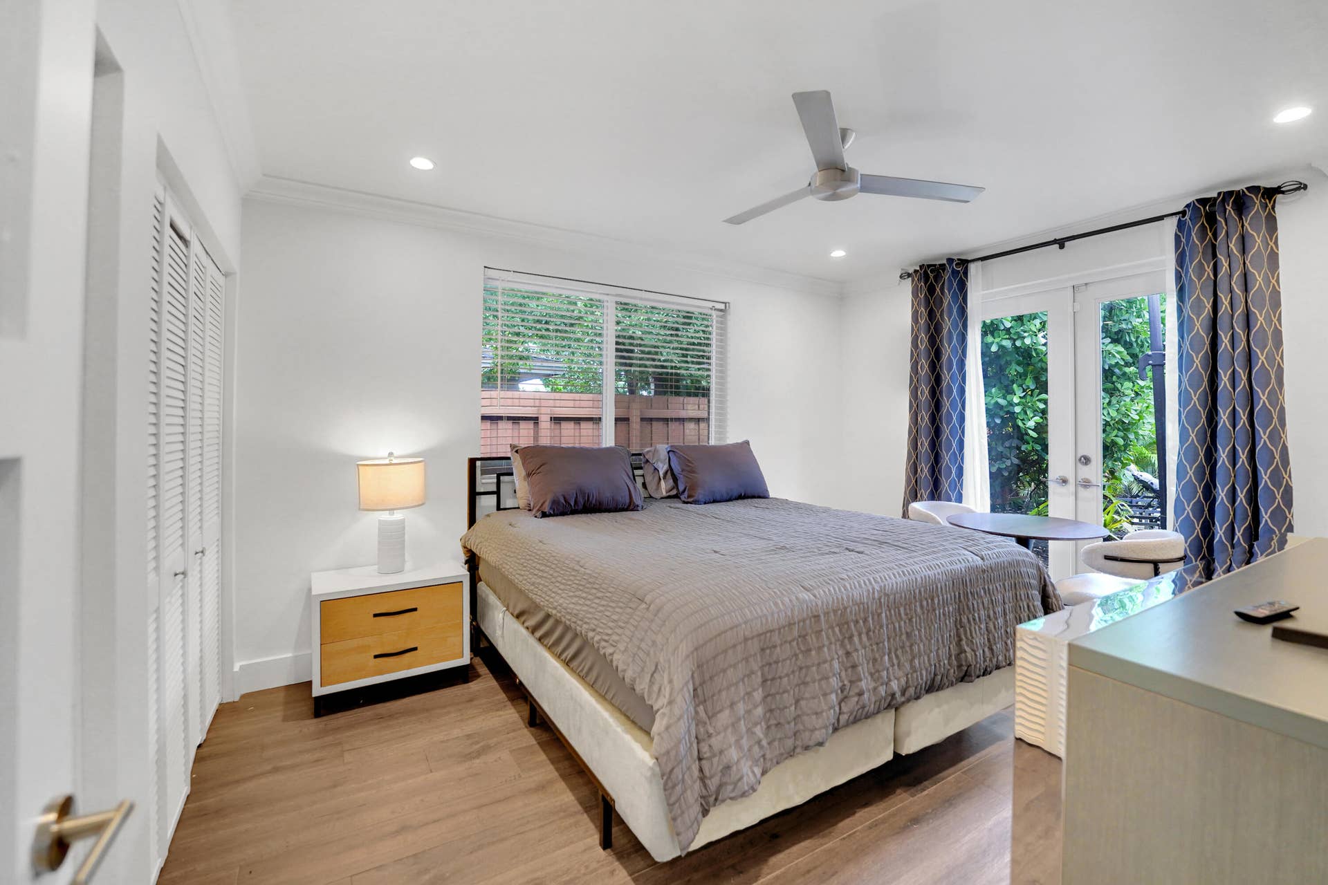 380 NW 35TH Court, Oakland Park, FL 33309 Guest bedroom with french doors to patio and pool.