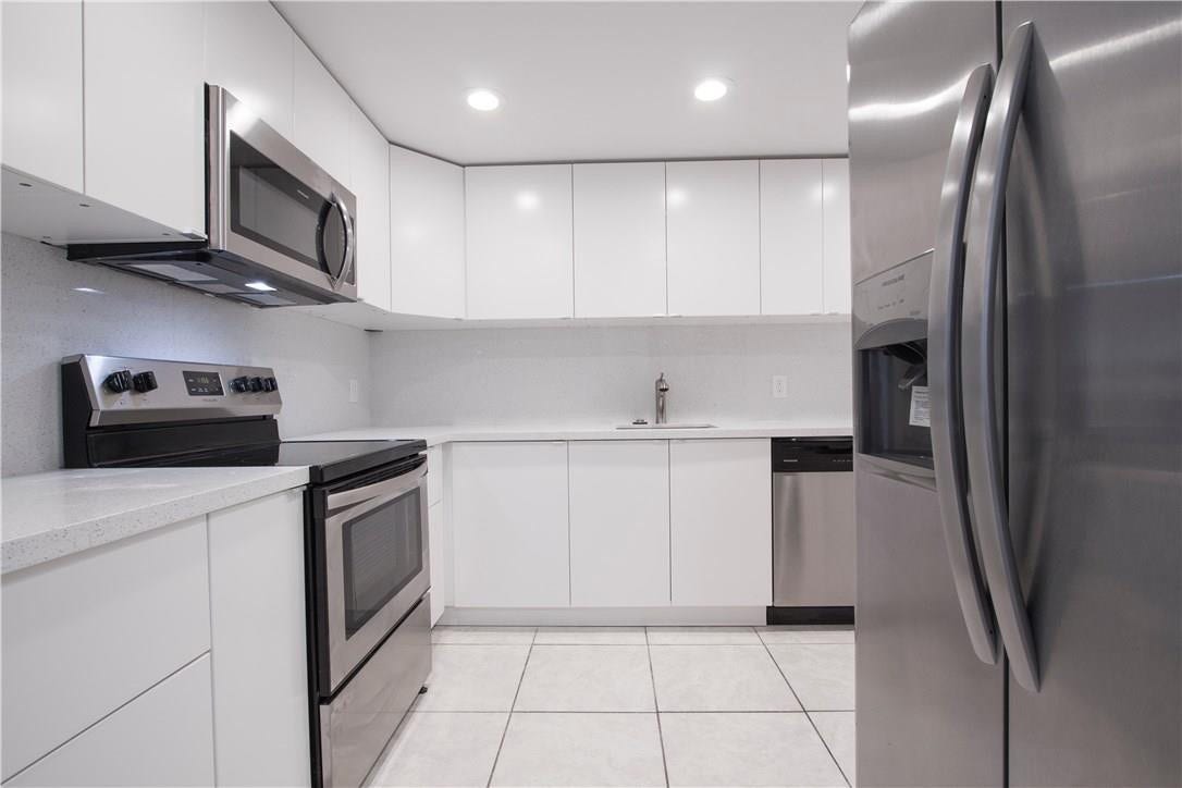 updated kitchen w/ SS appliances & quartz