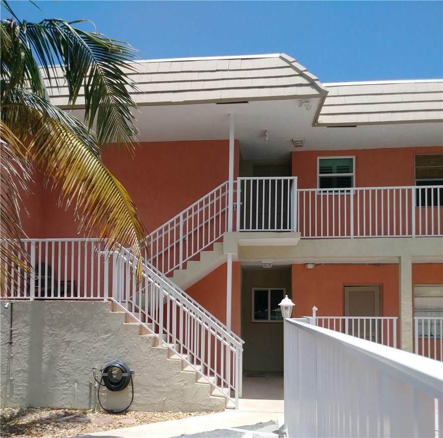 1450 N Riverside Drive, #201, Pompano Beach, FL 33062 Stairway to unit that has two doors of entry. One through living room area and the other through the kitchen