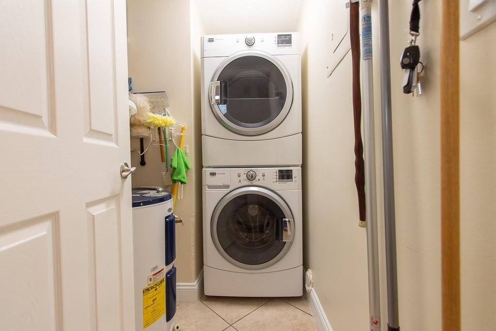 Separate laundry room with Maytag washer and dryer