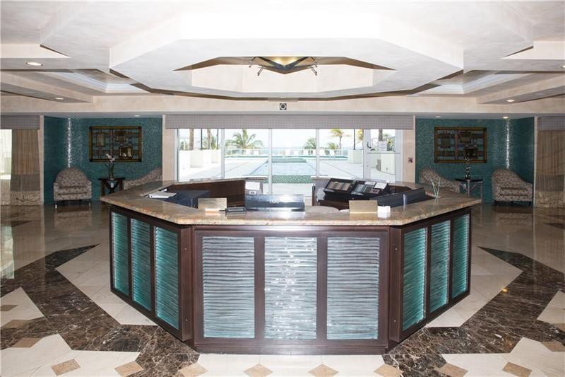 3400 Galt Ocean Drive, #1509 S, Fort Lauderdale, FL 33308 Southpoint has 24/7 security. The two luxury high rise towers are connected by this lovely lobby. A view out to the beautiful pool deck is visible.