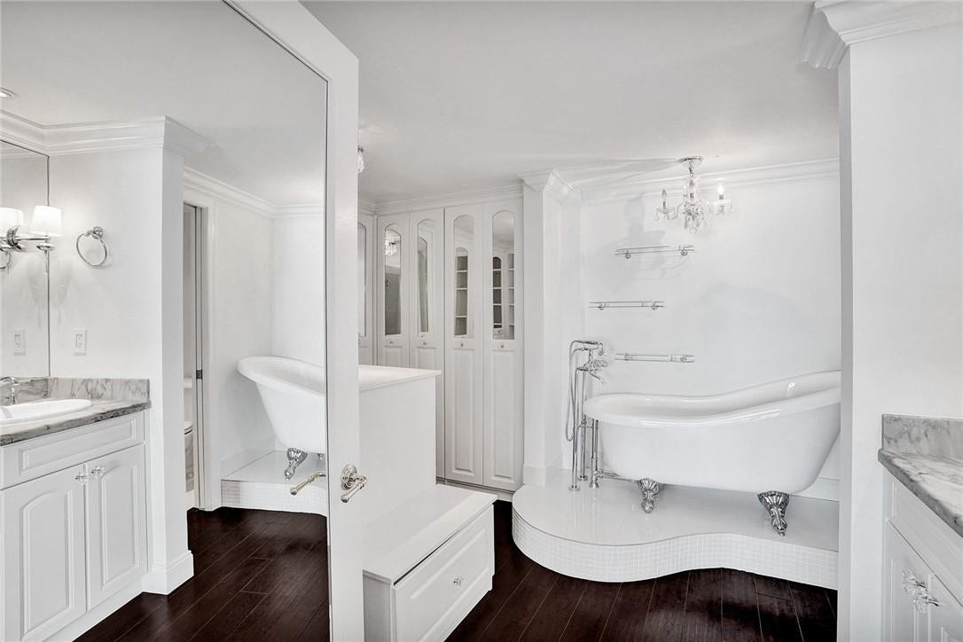 3400 Galt Ocean Drive, #1509 S, Fort Lauderdale, FL 33308 As soon as you enter the master bathroom, you will see an English claw foot tub sitting on a custom built platform. To the left, the owner has made the most out of her walk in closet area, incorporating lots of custom built closet space.