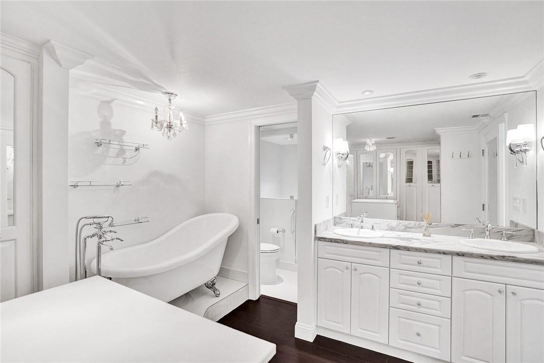 3400 Galt Ocean Drive, #1509 S, Fort Lauderdale, FL 33308 The double sink marble top vanity, the choice of fixtures, and the chandelier light fixture give this master bathroom a soothing and spa like feeling.