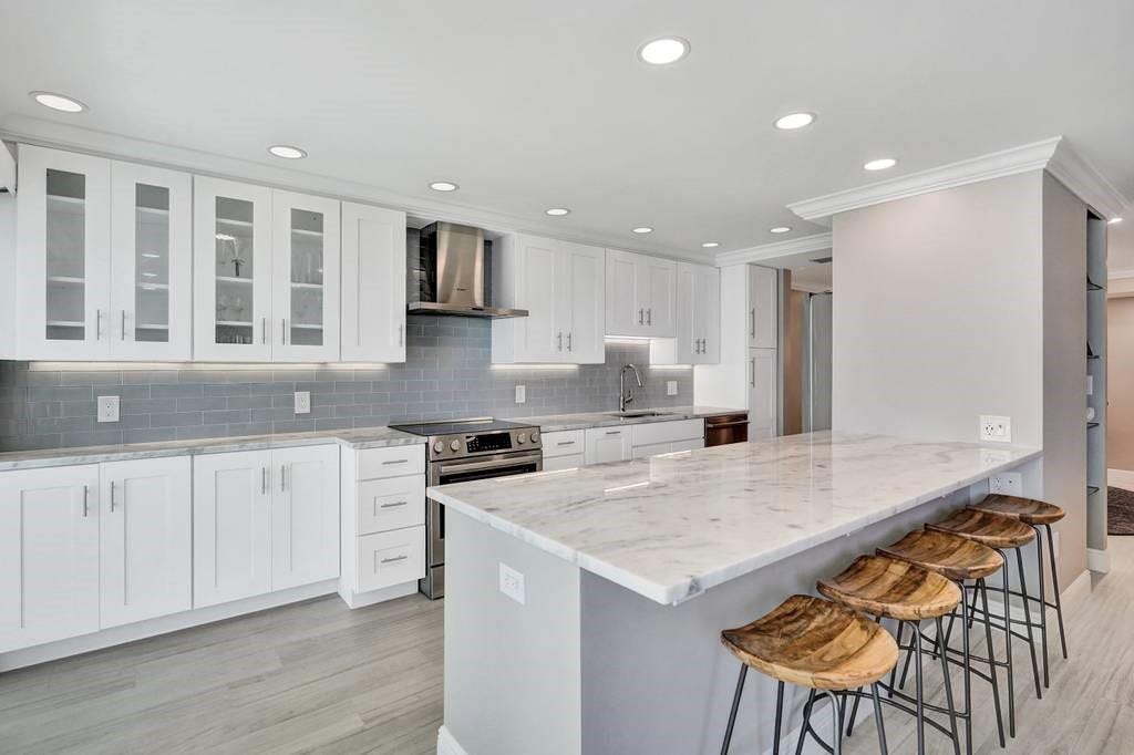 It is amazing how much removing a wall can open up and brighten a kitchen.