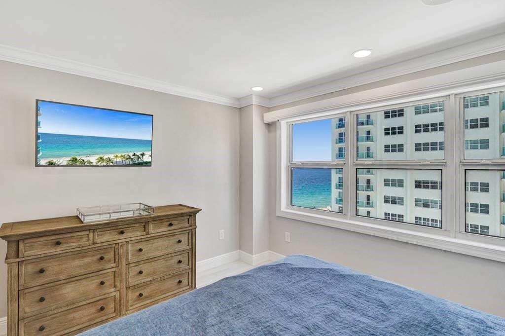 The second bedroom also has a view of the ocean from the bed.
