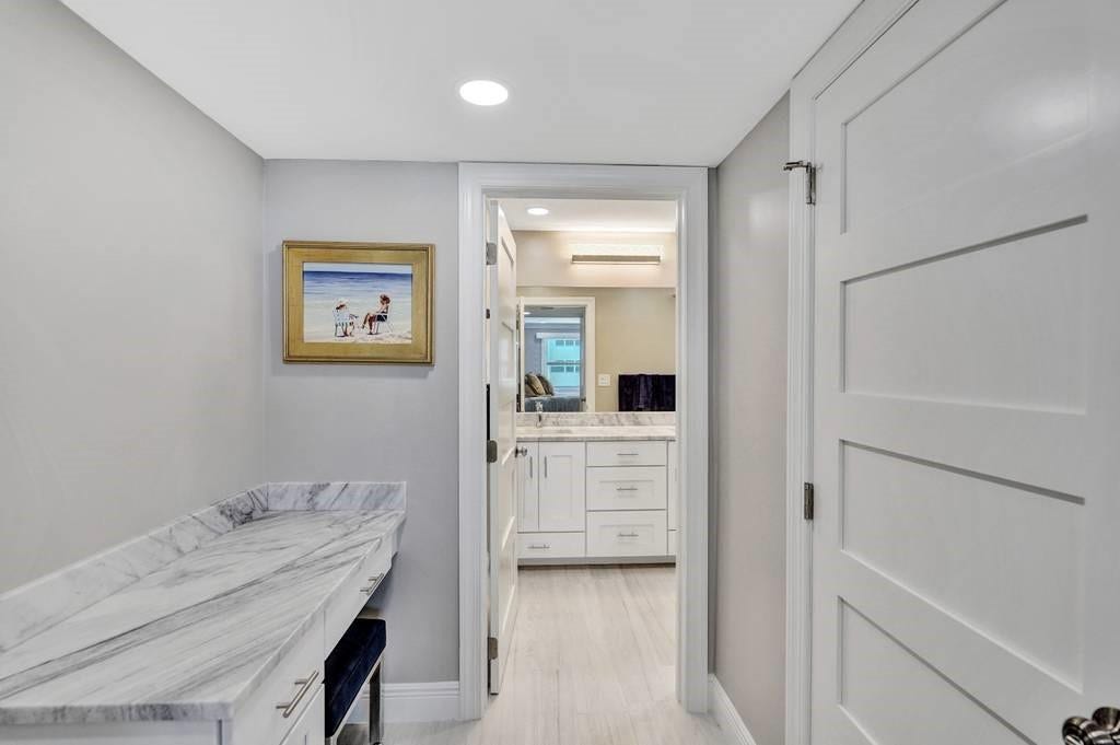 Entry way from the master bedroom to the master bathroom. The door on the right leads into the master bedroom walk in closet.