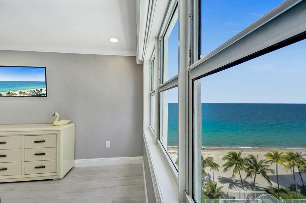 Master bedroom view of the upper pool deck, the beach and the ocean.