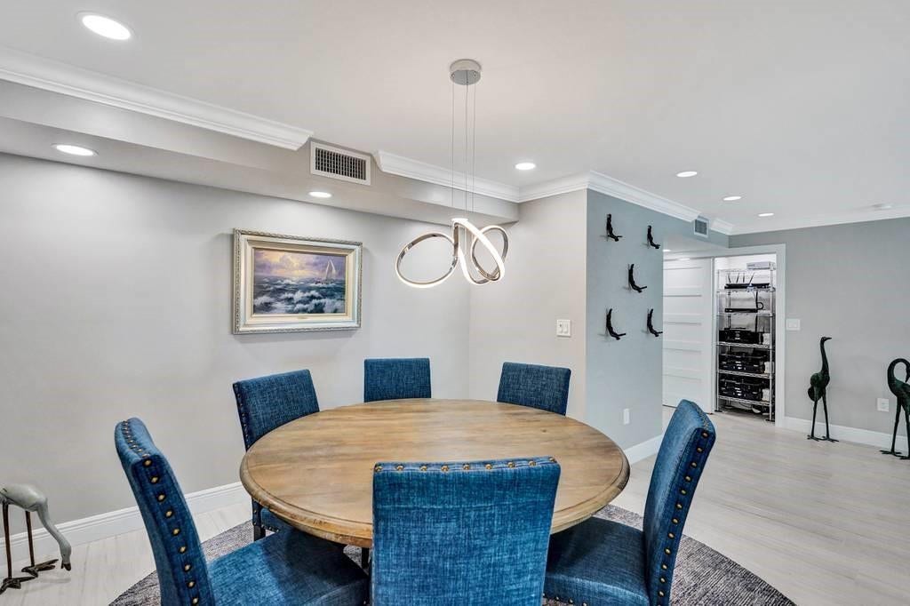 The dining room. Note the open closet door in the entryway. This is a smart home and all of the smart components are housed in the closet.