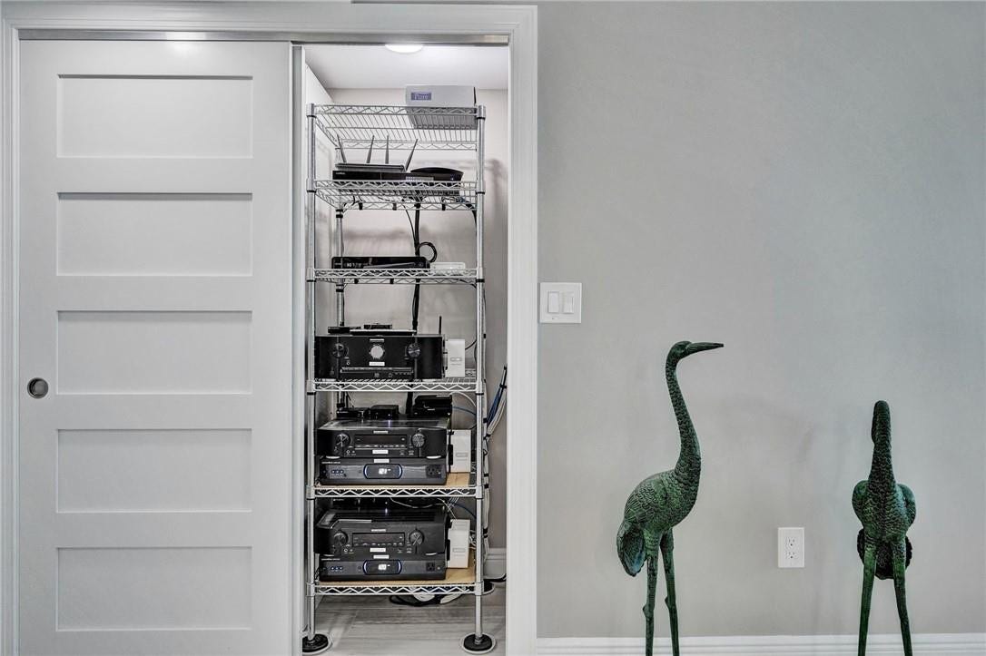 Located in the entry way hall, this home has been fitted with smart home components, which controls the tv's, the surround sound, the lighting, the nest thermostat, i pads and the electric solar shades.