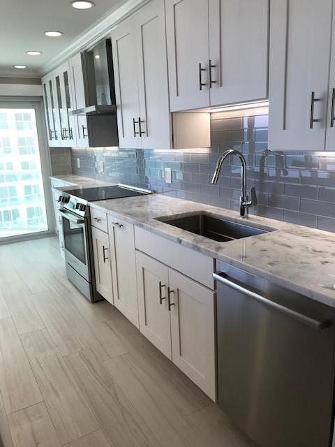 The kitchen cabinets were extended to the balcony sliding doors, giving this kitchen plenty of storage. All of the drawers are self closing. The faucet is Hansgrohe. The dishwasher is Bosch.