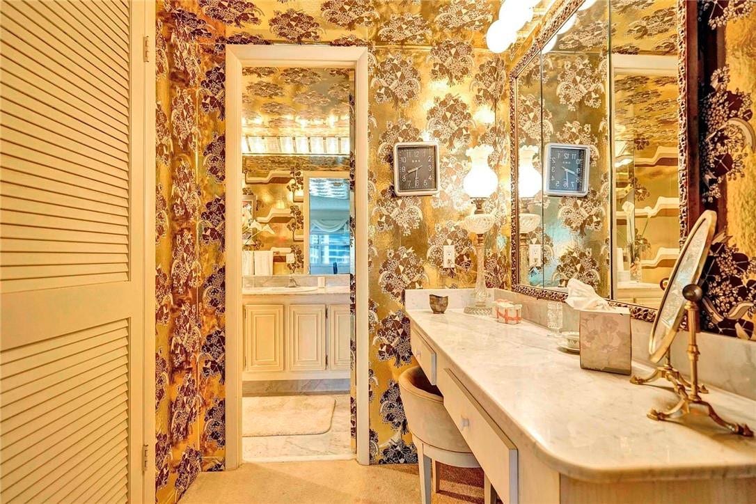 3400 Galt Ocean Drive, #1104 S, Fort Lauderdale, FL 33308 Leading into the main bathroom, the walk in closet is the door on the left and the vanity area is on the right.