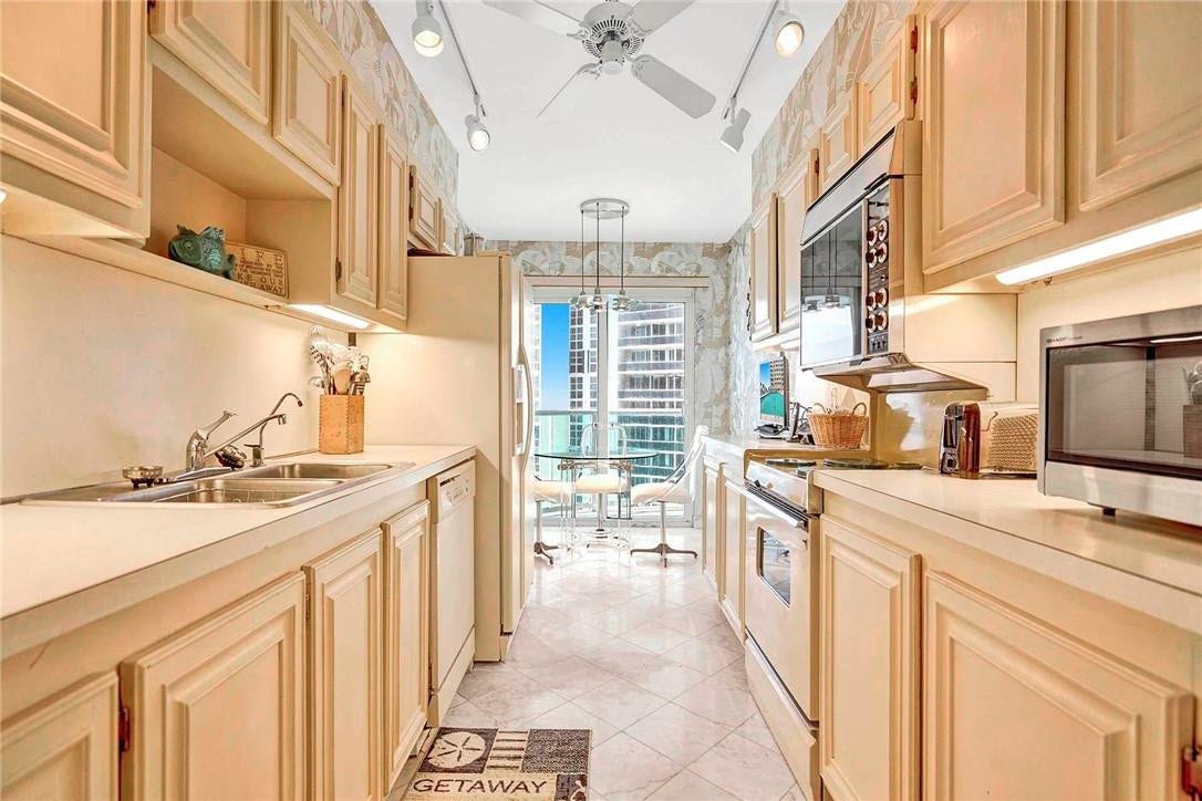 3400 Galt Ocean Drive, #1104 S, Fort Lauderdale, FL 33308 The kitchen has sliding doors that lead out to the balcony. The microwave is excluded from the sale.