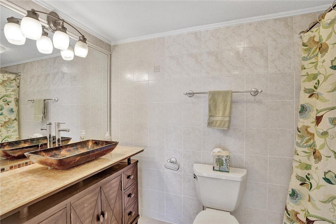 The second bathroom is located across from the second bedroom.