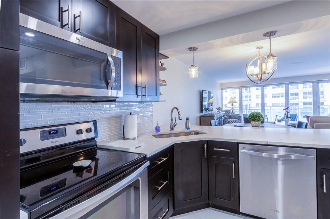 3430 Galt Ocean Drive, #410, Fort Lauderdale, FL 33308 kitchen with ss appliances and quartz counter tops