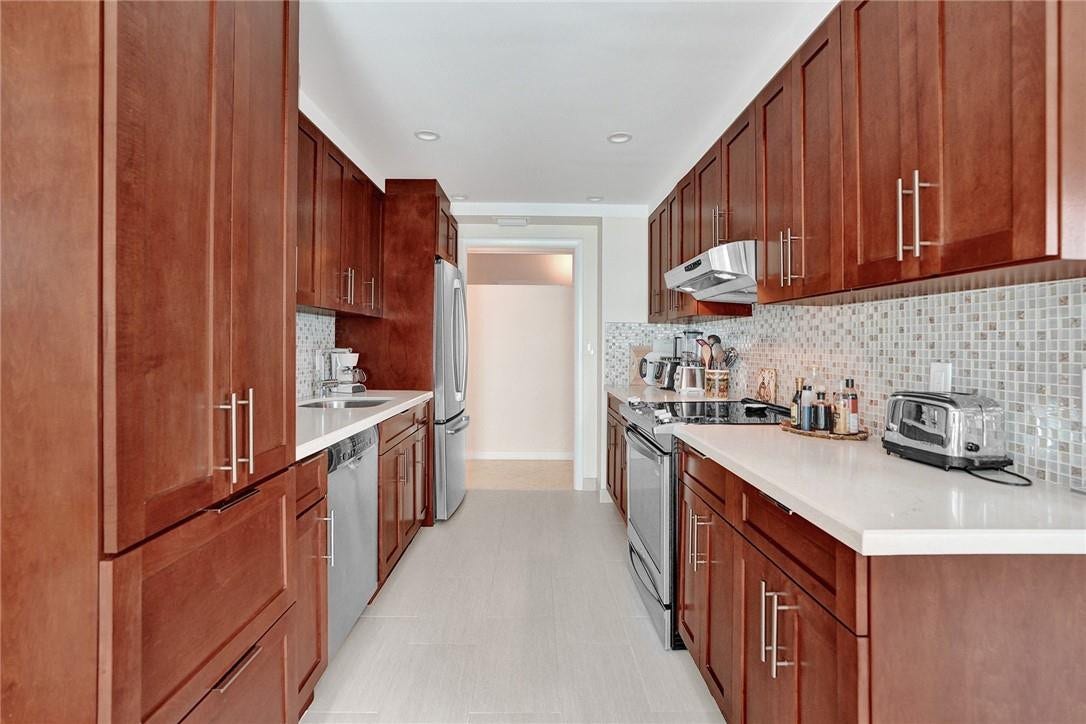 With your back to the sliding doors that lead out to the balcony: the second bedroom/den wall is directly in front of you.