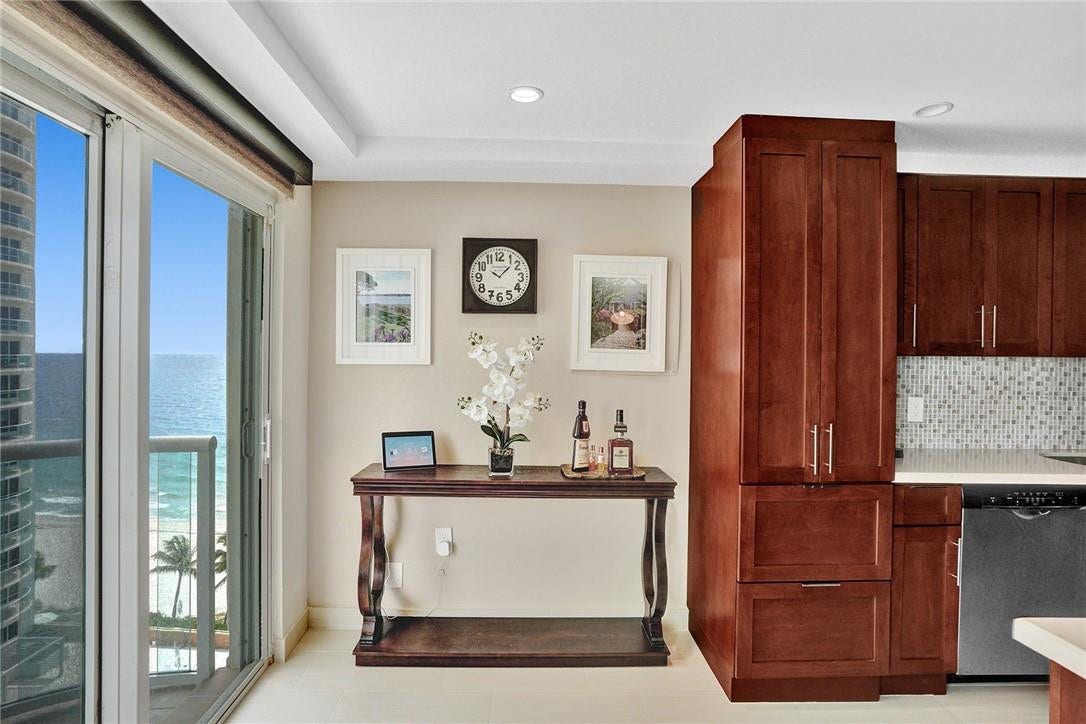 This area is roomy enough and perfect for a table. The two pictures and the Alexa do not convey with the sale.