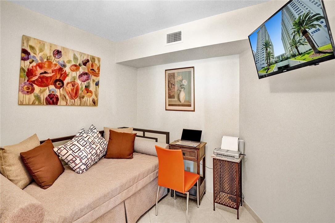 The dining room area was enclosed to create a second bedroom. The picture over the desk, the laptop and the printer do not convey with the sale.