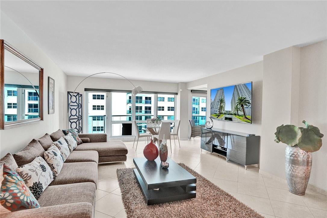 This apartment faces the pool deck. The door to the right of the screen leads out on to the balcony.
