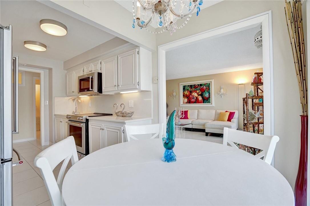 With your back to the sliding glass doors, you can see into the living room. Facing in the other direction, you can see the new wall and the window that the owner installed when the dining room was converted into another room.