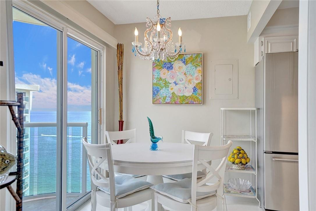 Kitchen eat in area. You have a beautiful ocean view while you are at the table.